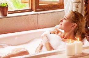 Lady relaxing in bath tub